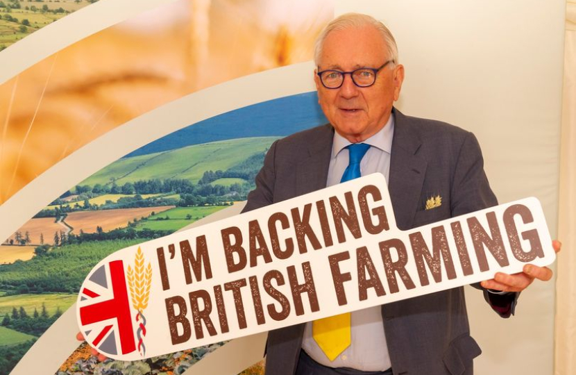 Sir Peter with a sign saying 'Back British Farming'