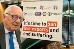 Sir Peter in front of a banner advocating for the ban of Live Exports 