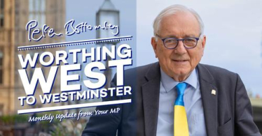 Sir Peter standing in front of Parliament