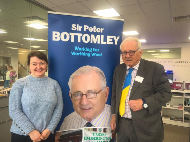 Sir Peter Bottomley with a constituent at a surgery