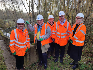 Sir Peter Bottomley with a team of sewage workers